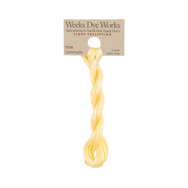 A skein of chiffon yellow embroidery floss, twisted and bundled, with a tan label featuring the brand name and color information.