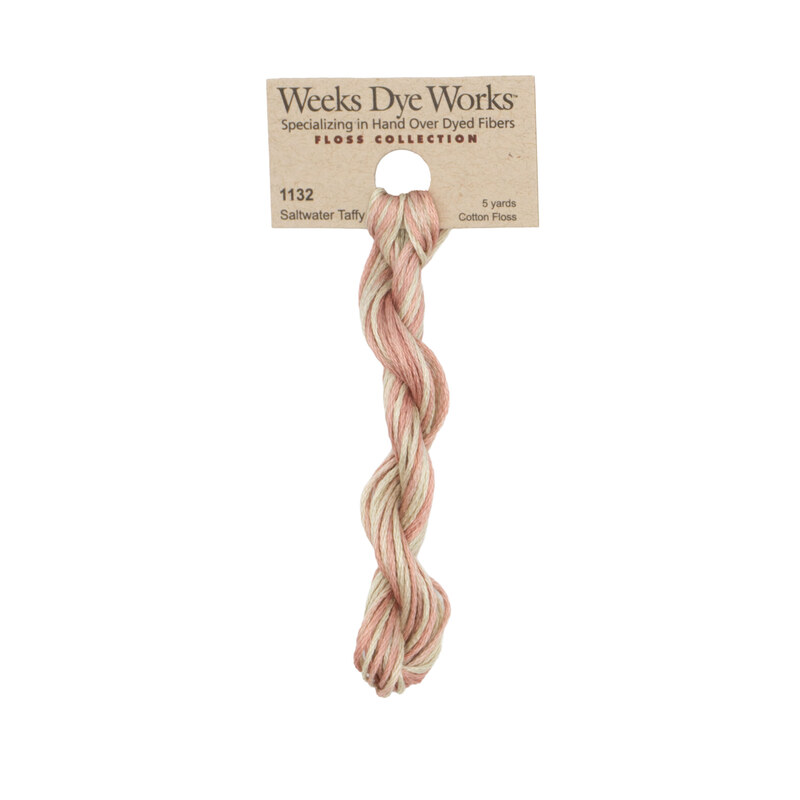A skein of Variegated Pink and Khaki embroidery floss, twisted and bundled, with a tan label featuring the brand name and color information.