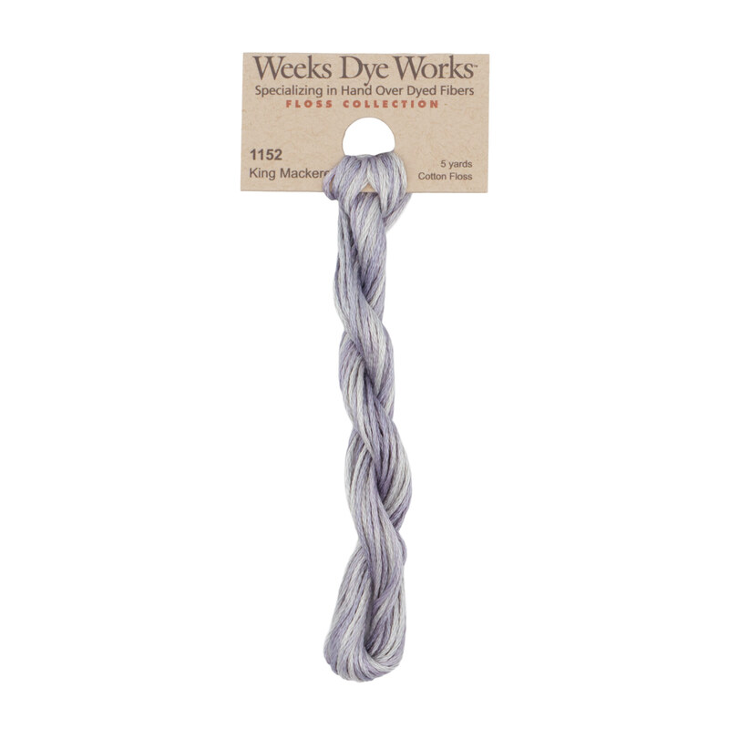 A skein of fish scale gray embroidery floss, twisted and bundled, with a tan label featuring the brand name and color information.