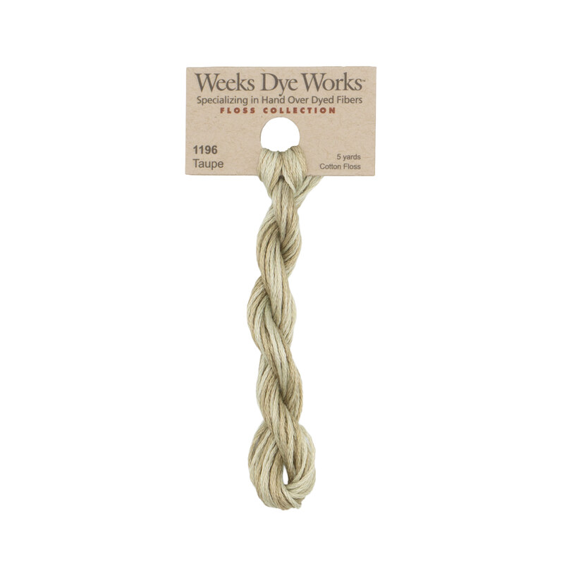 A skein of greenish taupe embroidery floss, twisted and bundled, with a tan label featuring the brand name and color information.