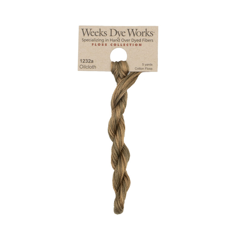 A skein of olive brown embroidery floss, twisted and bundled, with a tan label featuring the brand name and color information.