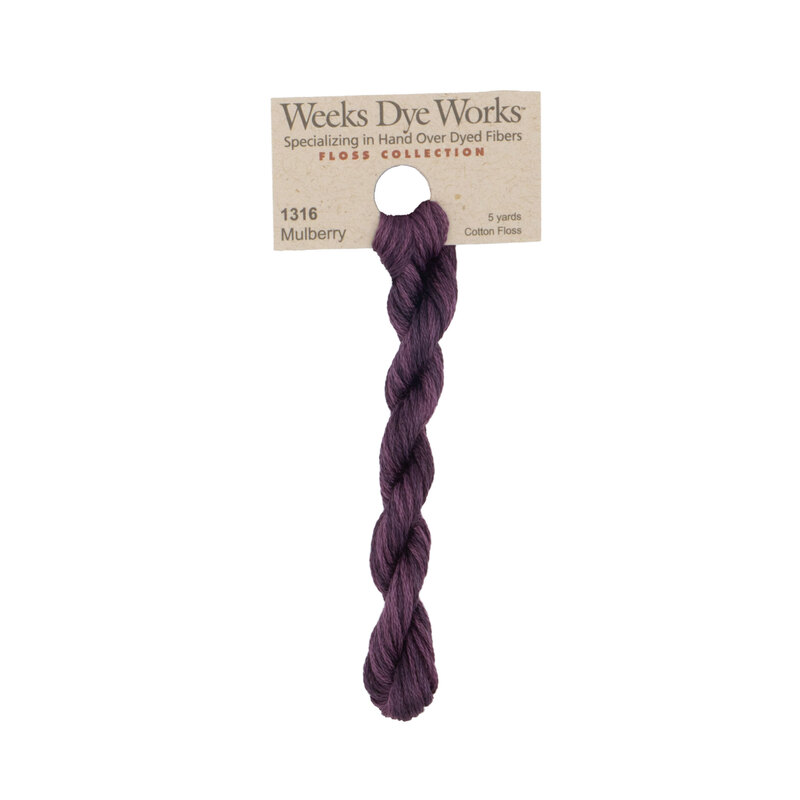 A skein of deep berry purple embroidery floss, twisted and bundled, with a tan label featuring the brand name and color information.