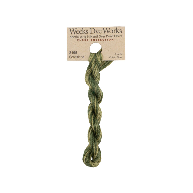 A skein of dark sage embroidery floss, twisted and bundled, with a tan label featuring the brand name and color information.