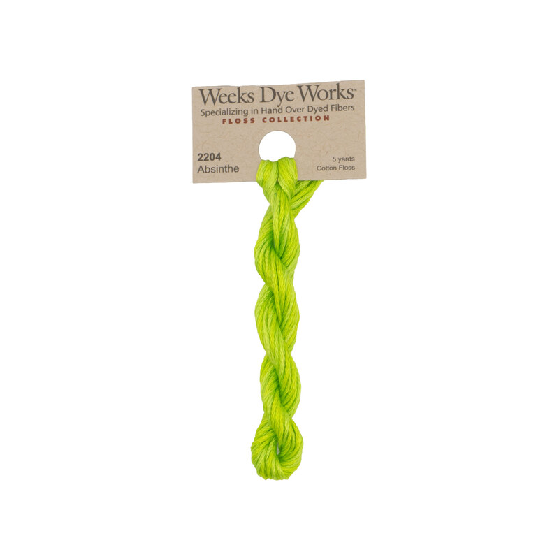 A skein of neon green embroidery floss, twisted and bundled, with a tan label featuring the brand name and color information.