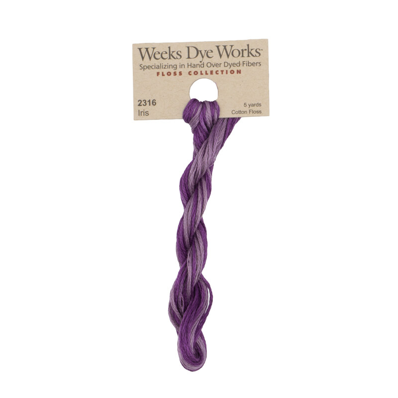 A skein of light and dark plum embroidery floss, twisted and bundled, with a tan label featuring the brand name and color information.