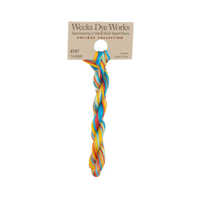 A skein of red, yellow, and blue embroidery floss, twisted and bundled, with a tan label featuring the brand name and color information.