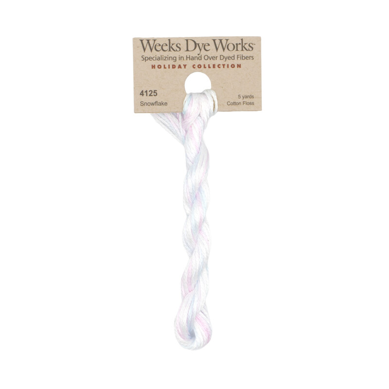 A skein of pale white, cyan, and lavender embroidery floss, twisted and bundled, with a tan label featuring the brand name and color information.