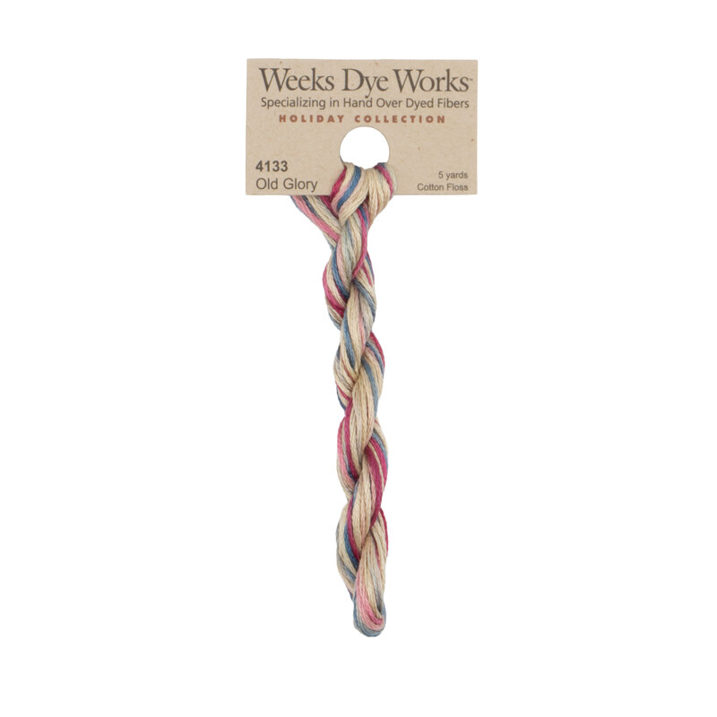 A skein of Variegated Muted Red, White, and Blue embroidery floss, twisted and bundled, with a tan label featuring the brand name and color information.