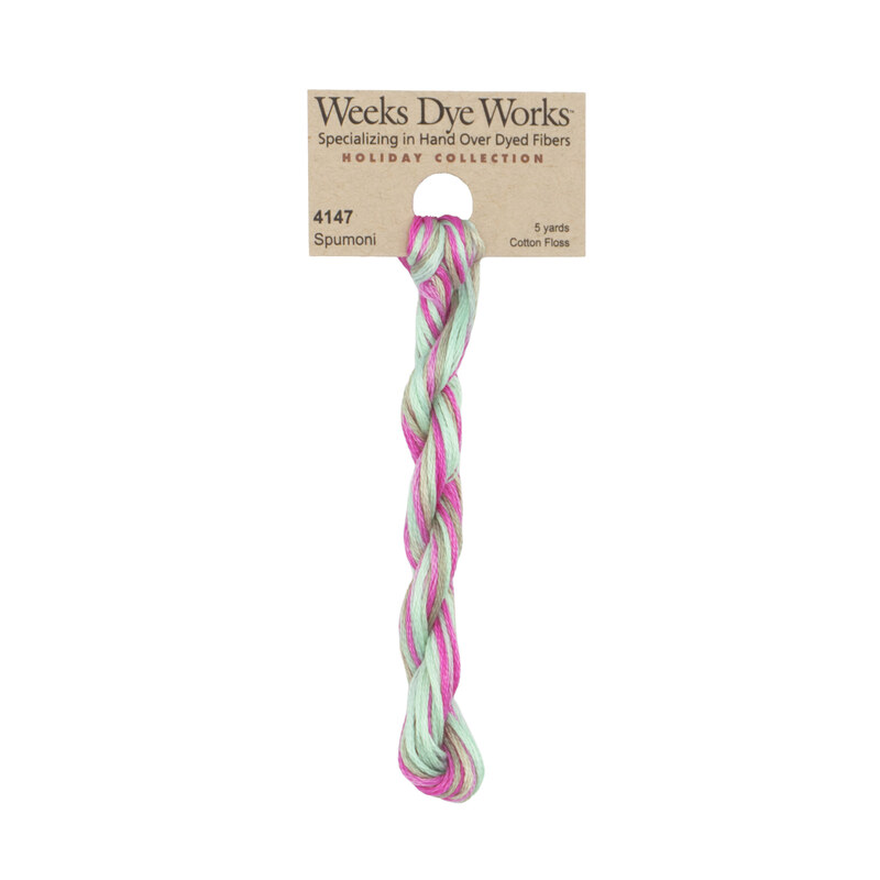 A skein of light green and magenta embroidery floss, twisted and bundled, with a tan label featuring the brand name and color information.