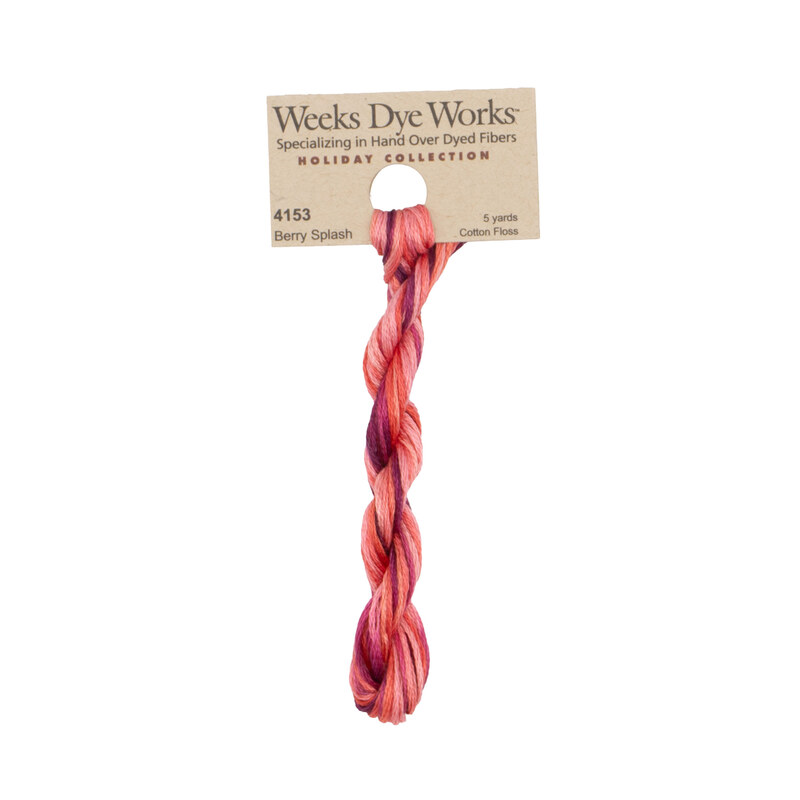 A skein of Variegated Hot Pink, Pink, and Magenta embroidery floss, twisted and bundled, with a tan label featuring the brand name and color information.