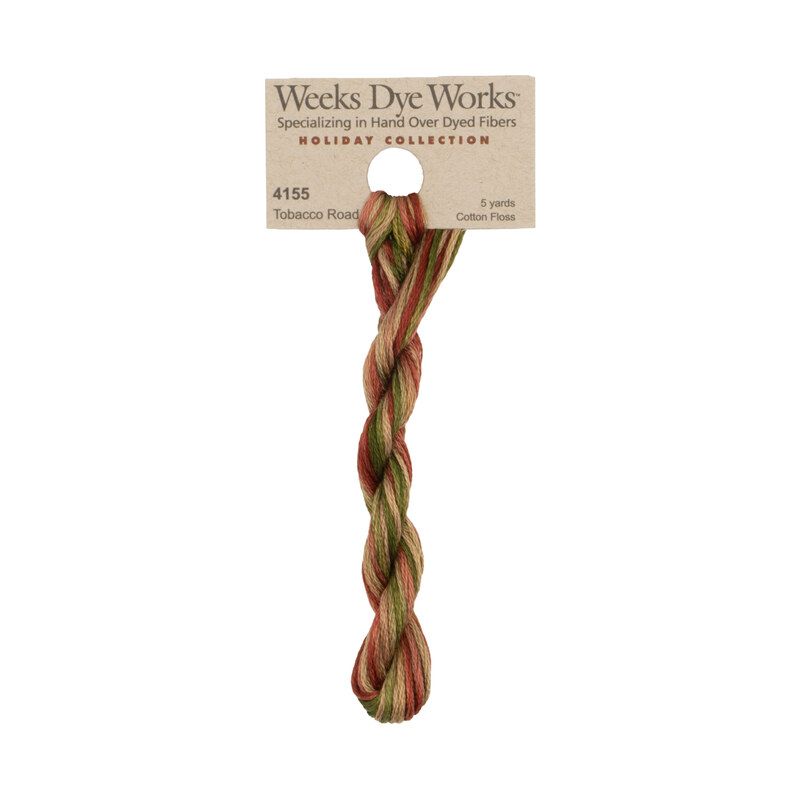 A skein of red, green, and tan embroidery floss, twisted and bundled, with a tan label featuring the brand name and color information.