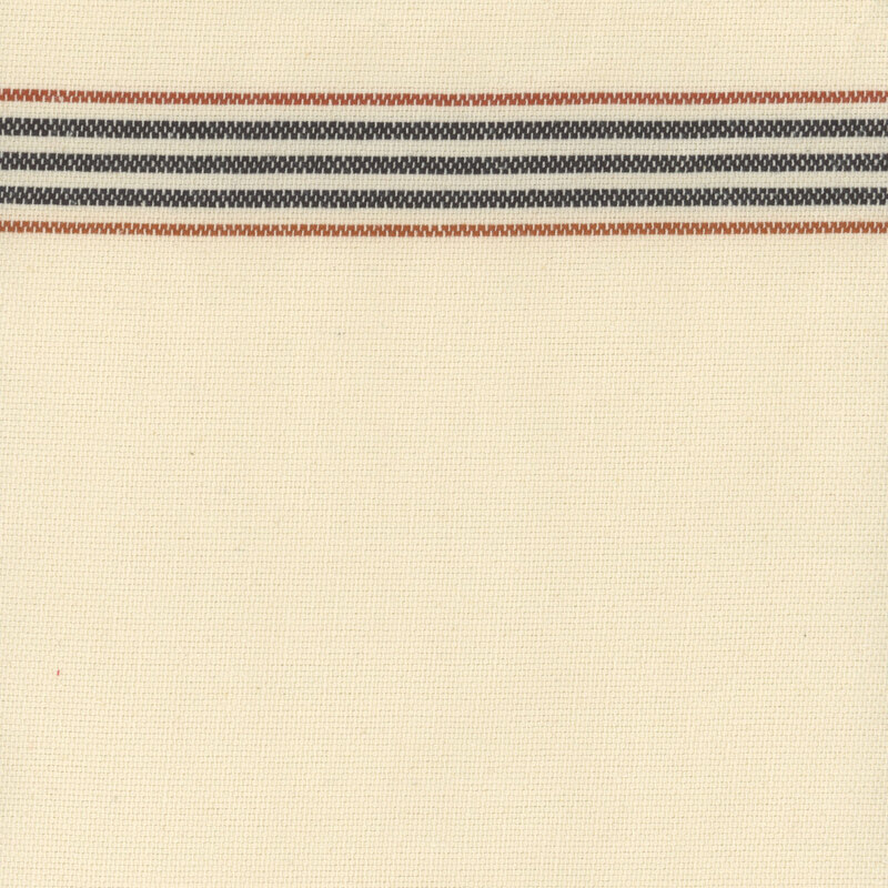 Swatch of the toweling, a natural cream color with black and orange striping.