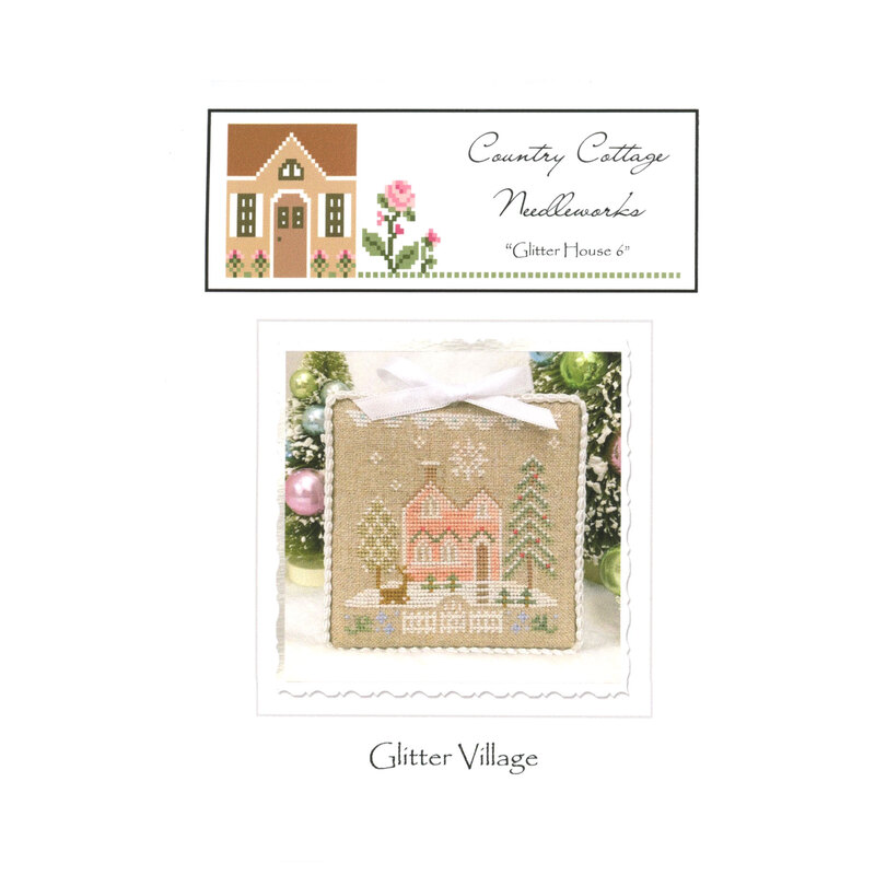 Front image of the "glitter house" pattern featuring a pink house with snowflakes, pine trees and a deer.