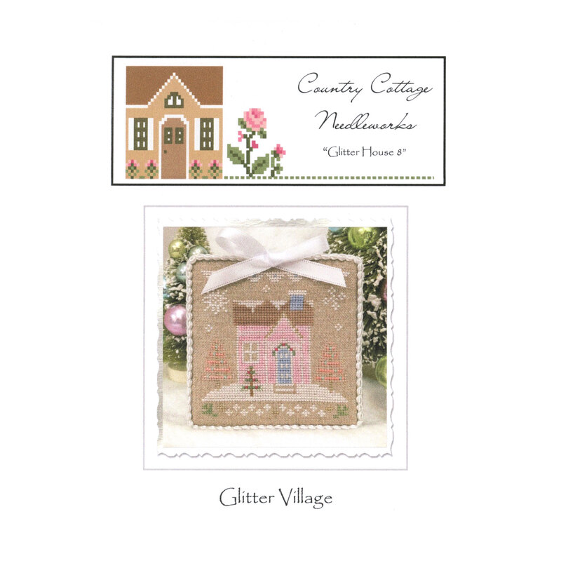 Front image of the "glitter house" pattern featuring a pink house with snowflakes and pink trees.