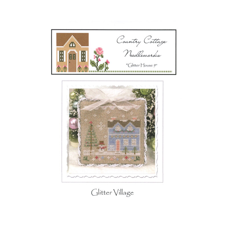 Front image of the "glitter house" pattern featuring a blue house with a snowman and a Christmas tree.