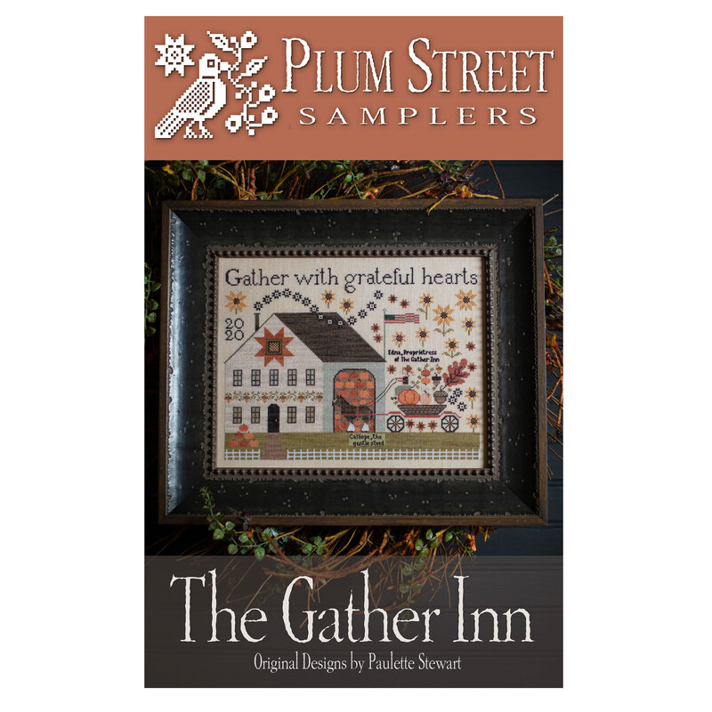 Front of pattern showing the completed cross stitch design framed with brambles in the background. 