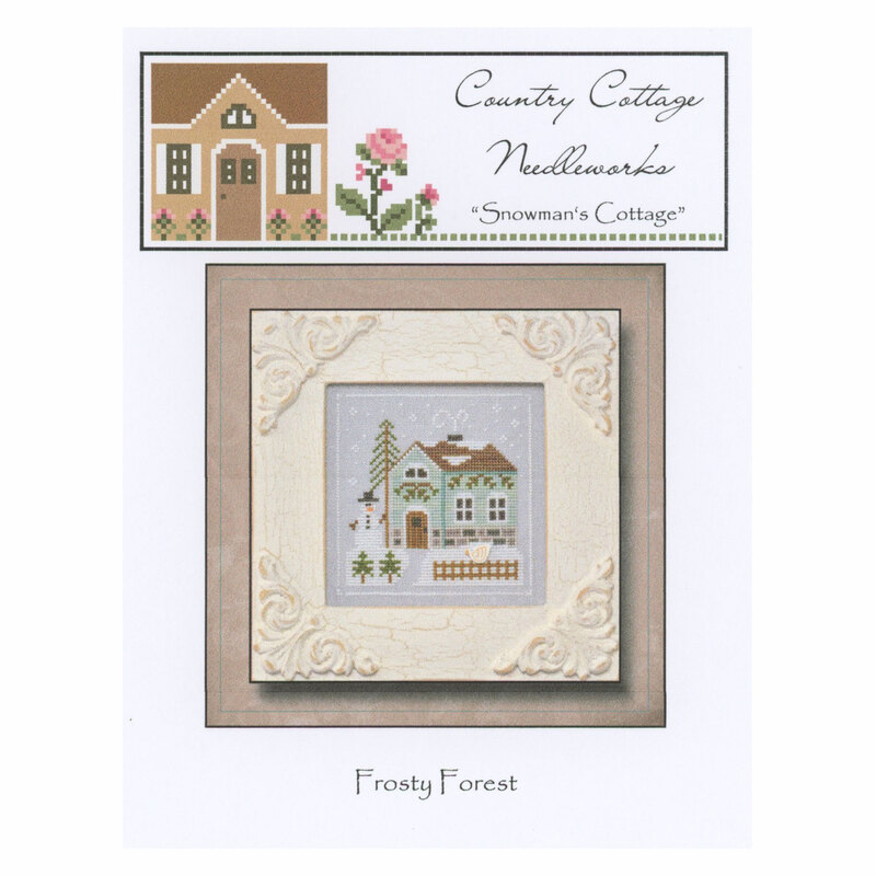 The front of the Frosty Forest Snowman's Cottage pattern featuring a snowy cabin with a snowman standing outside.