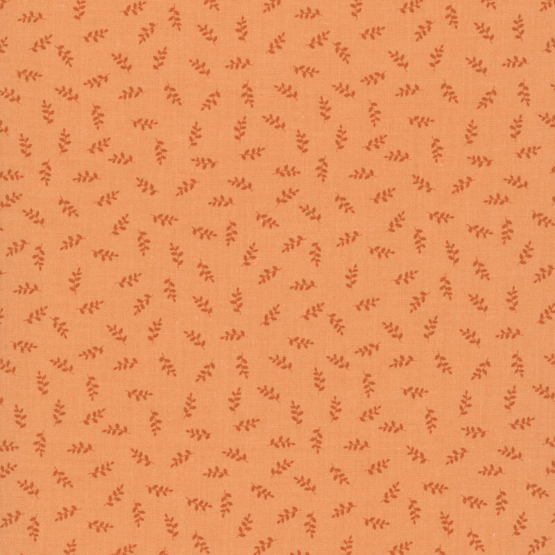 Fabric swatch featuring a tossed sprig pattern in tonal orange hues.