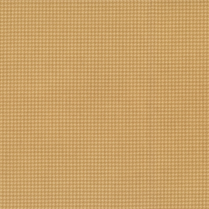 A houndstooth fabric swatch in tonal mustard yellow hues.