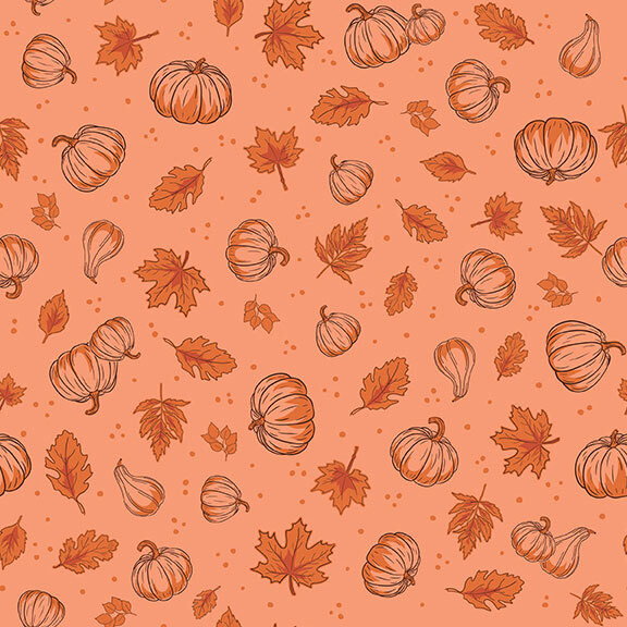 A tonal melon fabric with a pattern of tossed leaves, pumpkins, and dots.