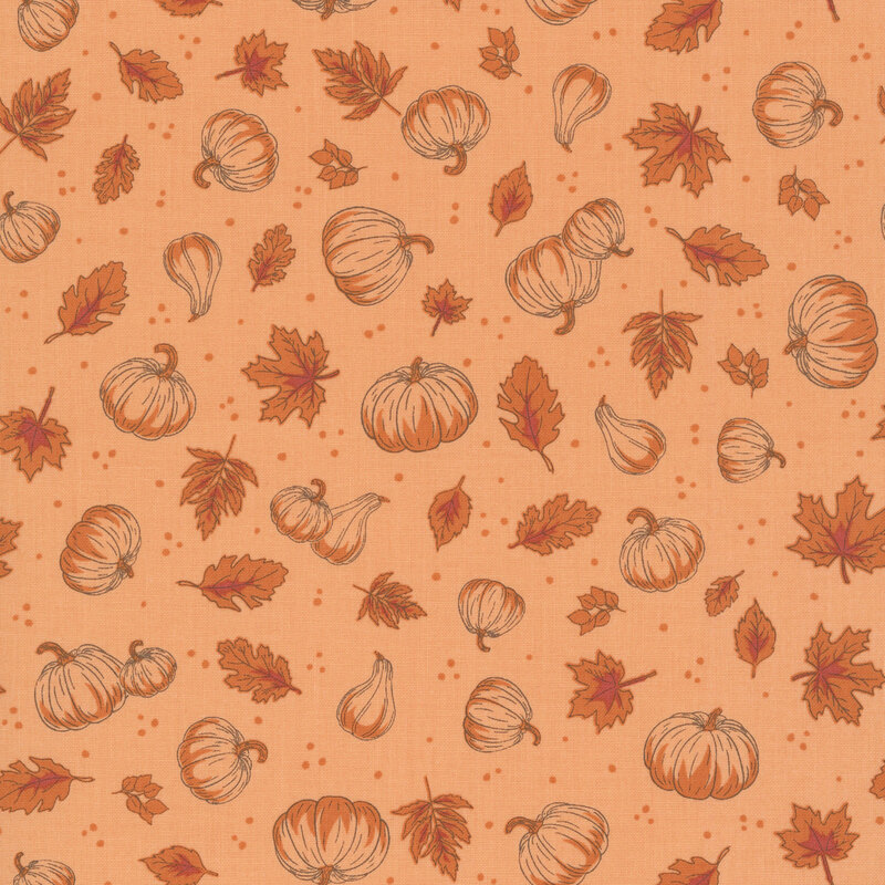 A tonal melon fabric with a pattern of tossed leaves, pumpkins, and dots.