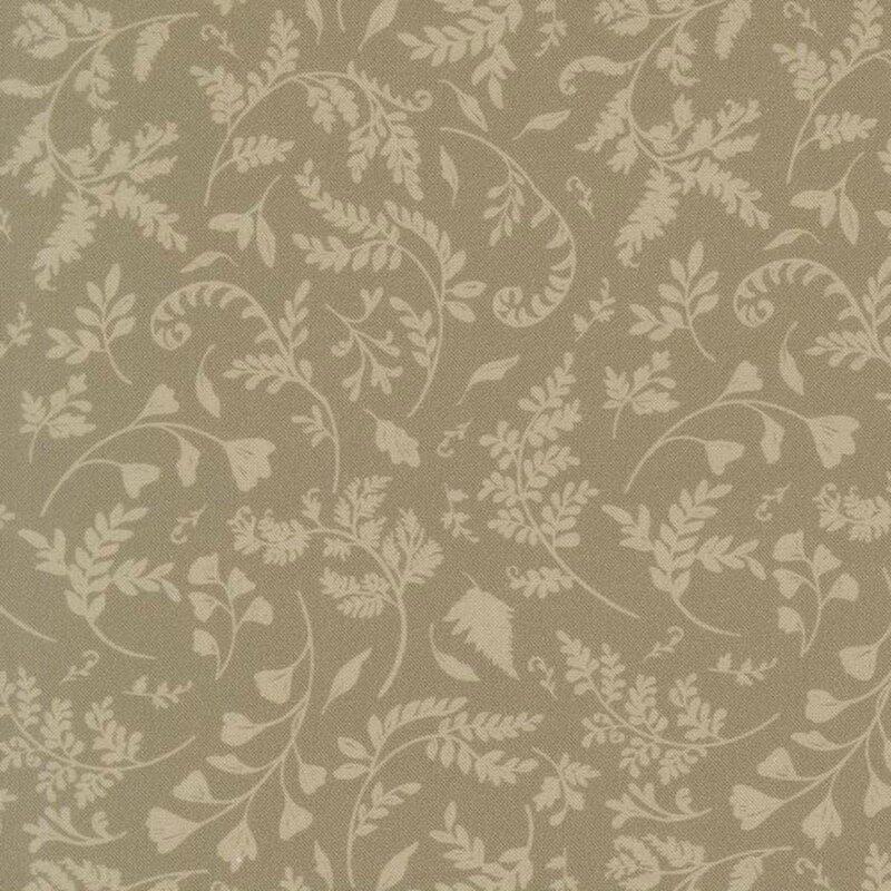 A dusty khaki fabric featuring a tossed vine and leaf print.