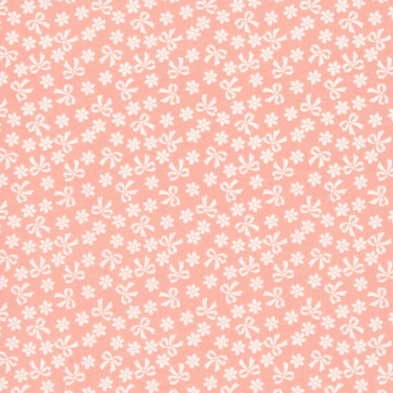 Peach fabric with cream bows and flowers.