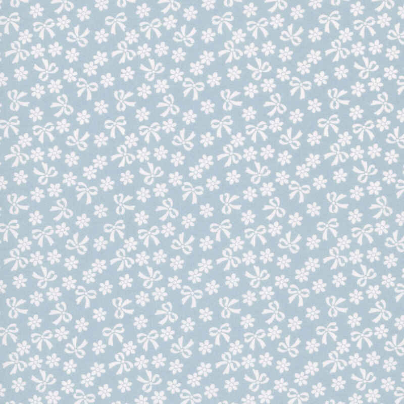 Baby blue fabric with cream bows and flowers.