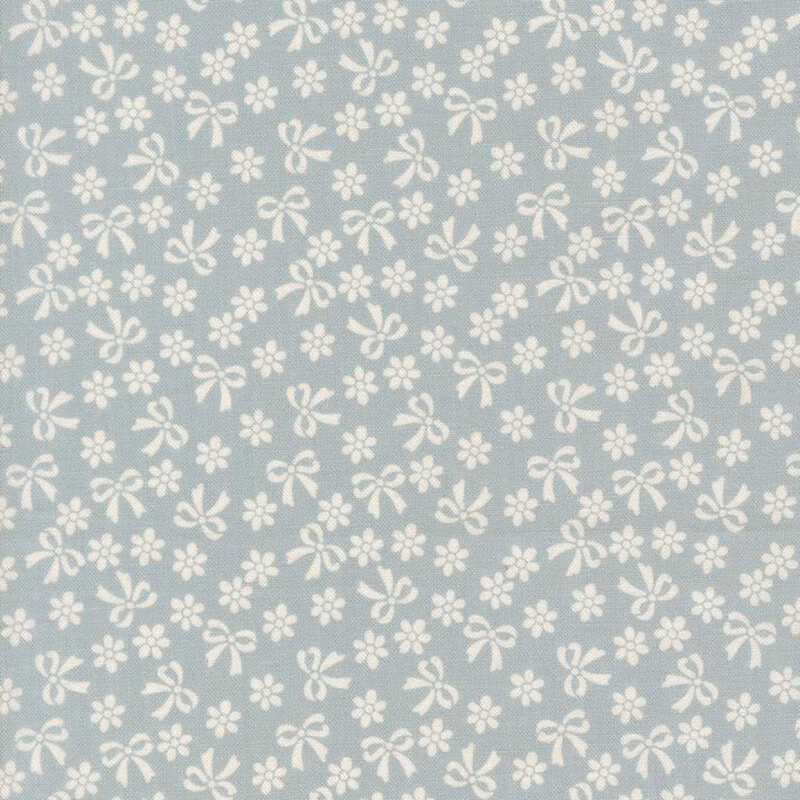 Baby blue fabric with cream bows and flowers.