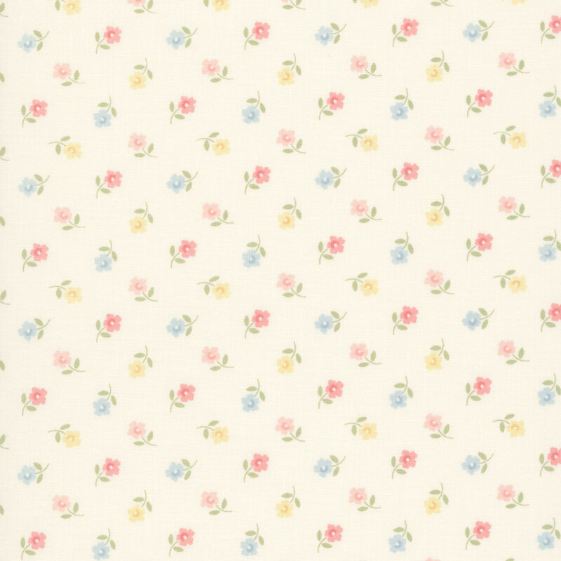Ditsy pattern of yellow, peach, pink, and blue flowers on a cream fabric.
