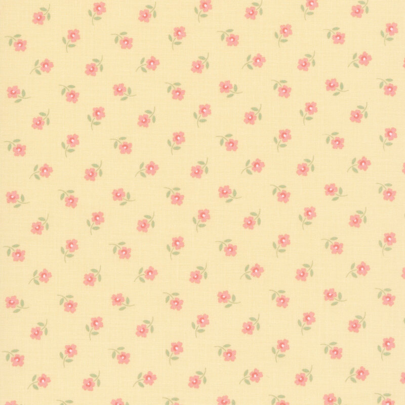 Ditsy pattern of pink flowers on a pastel yellow fabric.