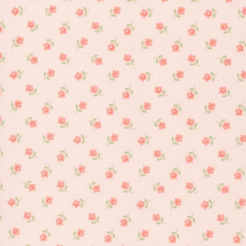 Ditsy pattern of peach flowers on a pastel pink fabric.