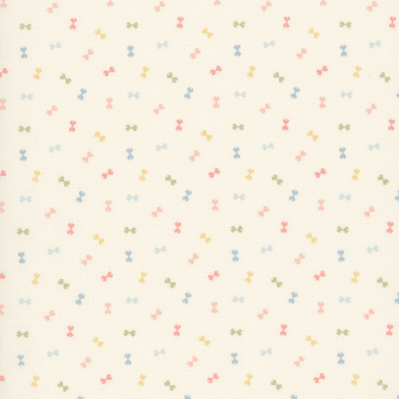 Cream fabric with a ditsy pattern of peach, yellow, green, and blue bowtie shapes