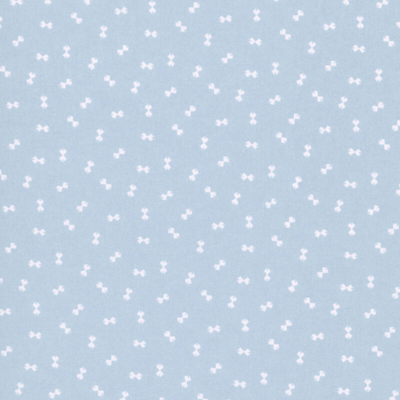Baby blue fabric with a ditsy pattern of cream bowtie shapes.