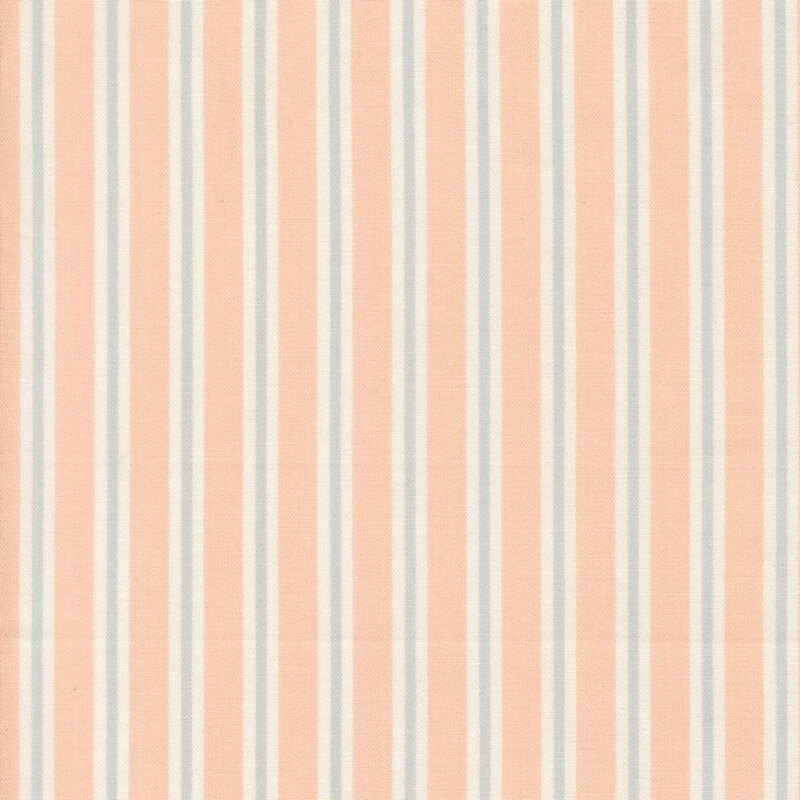 Peach fabric with cream and faded blue stripes