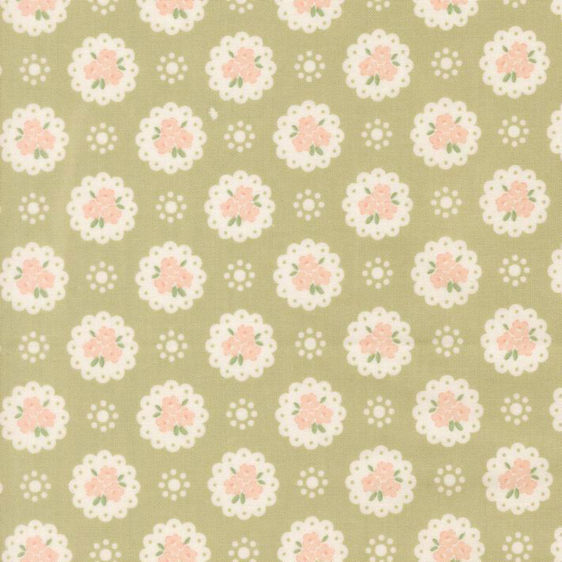 Pear green Quilting Cuddle fabric with a pattern of white doilies containing light peach flowers and white dots