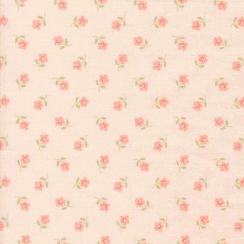 Ditsy pattern of peach flowers on a pastel pink Quilting Cuddle fabric.