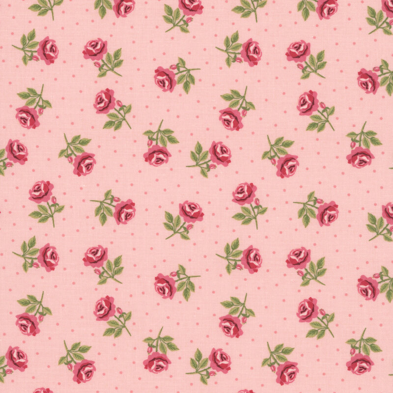 Coral pink fabric with pink polka dots and tossed dark pink, stemmed roses