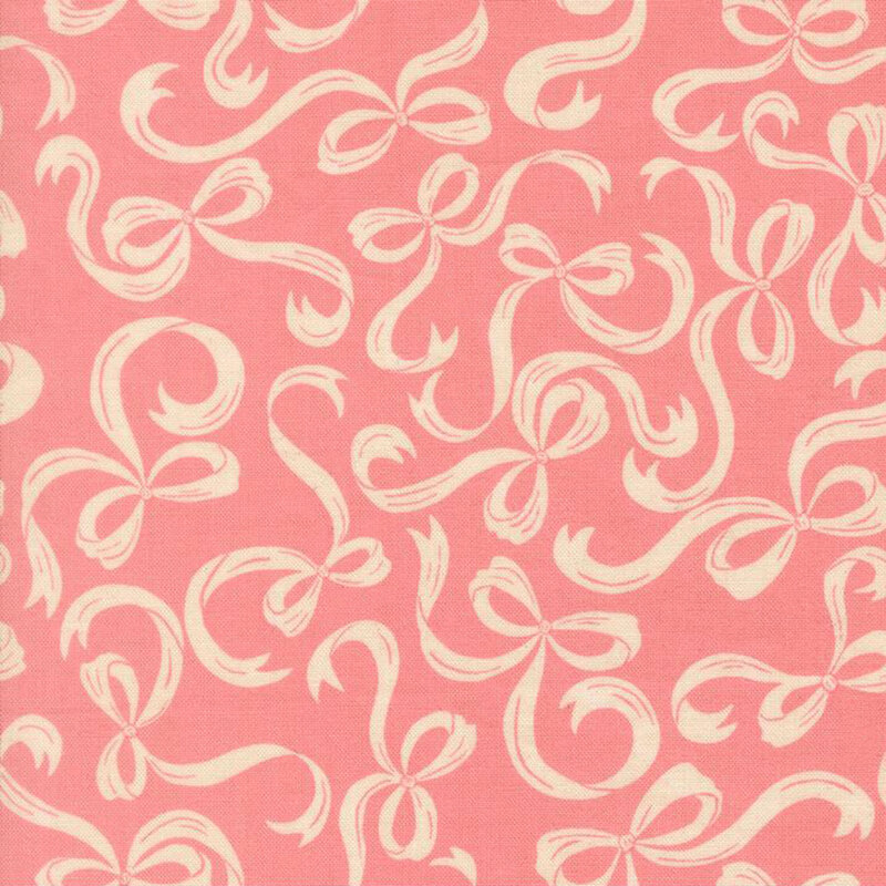 Coral pink fabric with a pattern of swirling cream bows