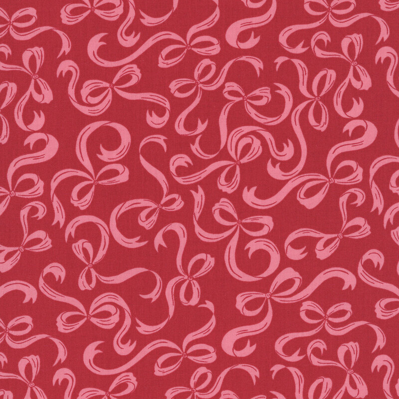 Lipstick red fabric with a pattern of swirling pink bows