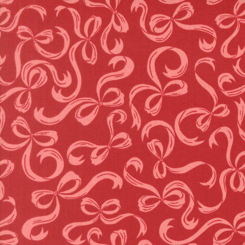 Lipstick red fabric with a pattern of swirling pink bows