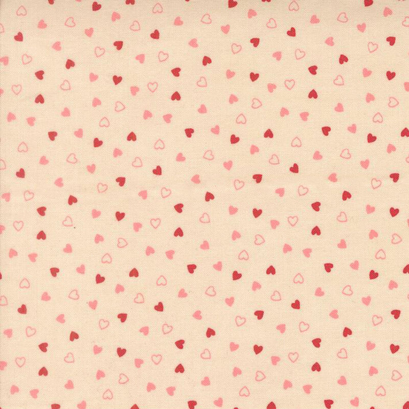 Tossed pink and red hearts on a beige background