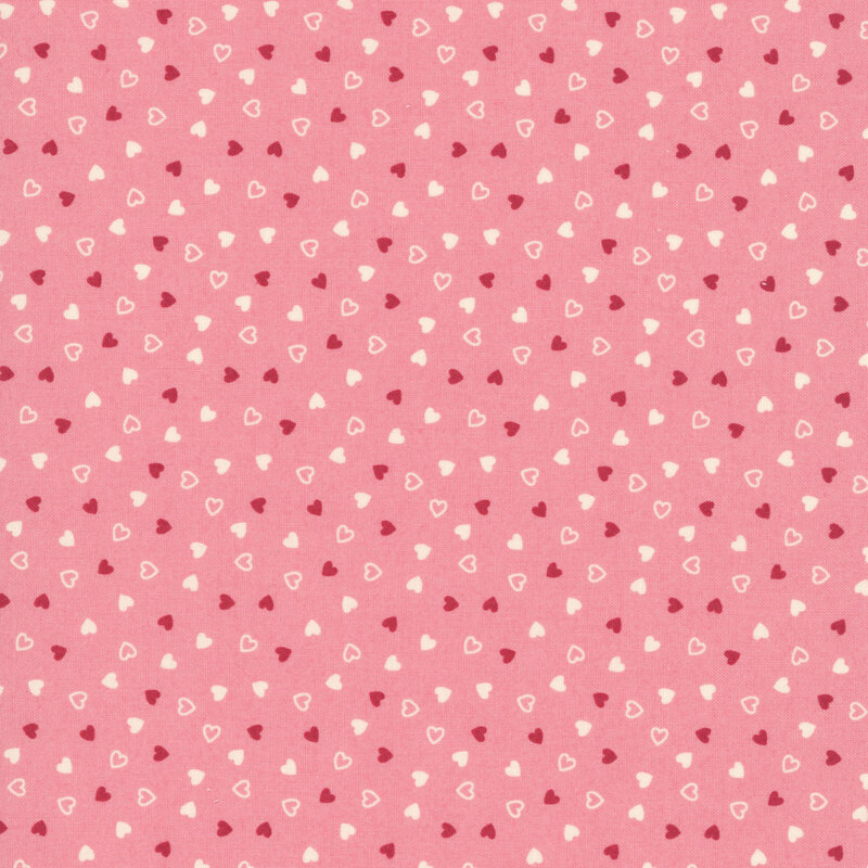 Tossed red and cream hearts on a coral pink background
