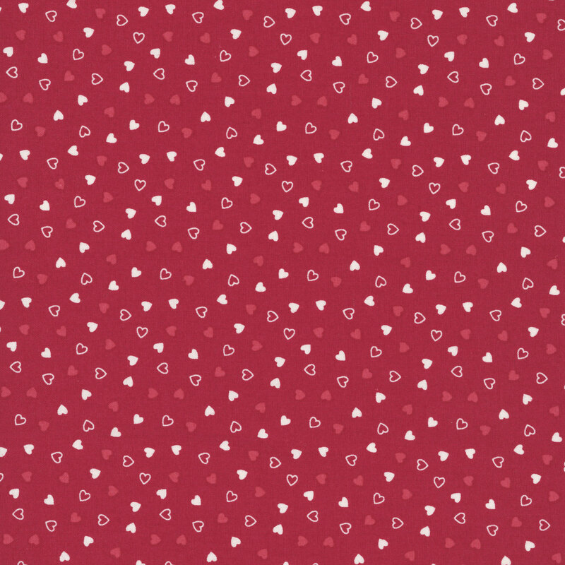 Tossed red and cream hearts on a burgundy red background