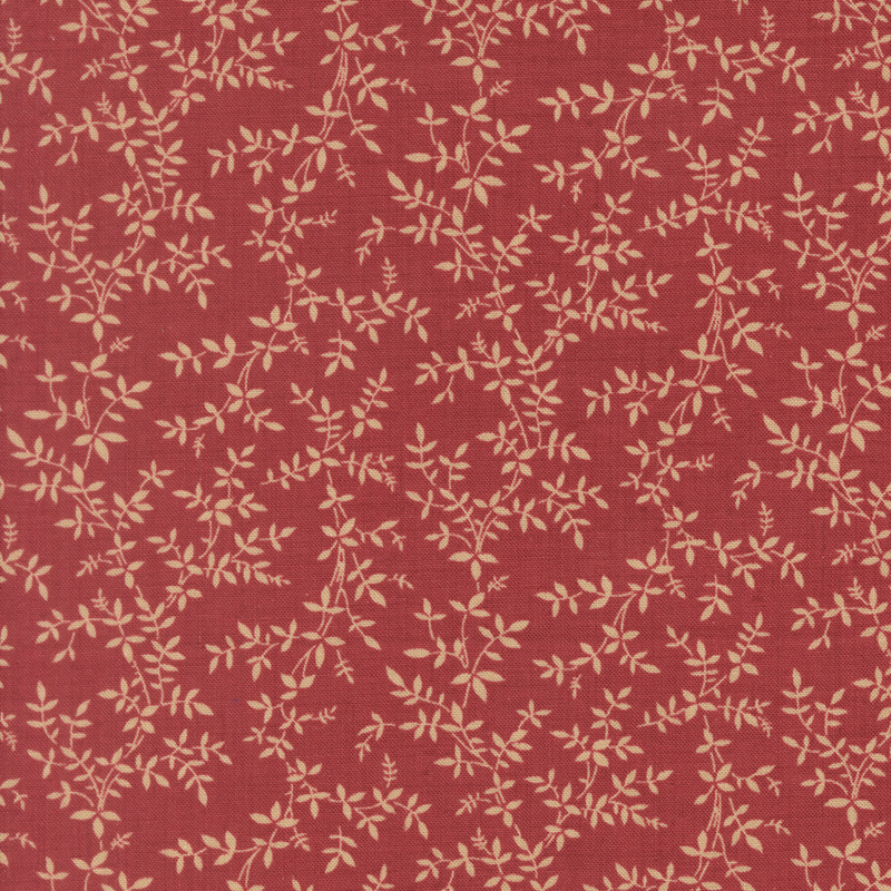 A rouge fabric featuring a beige vine print.