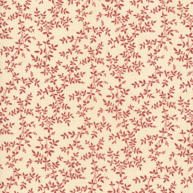 A cream fabric featuring a red vine print.
