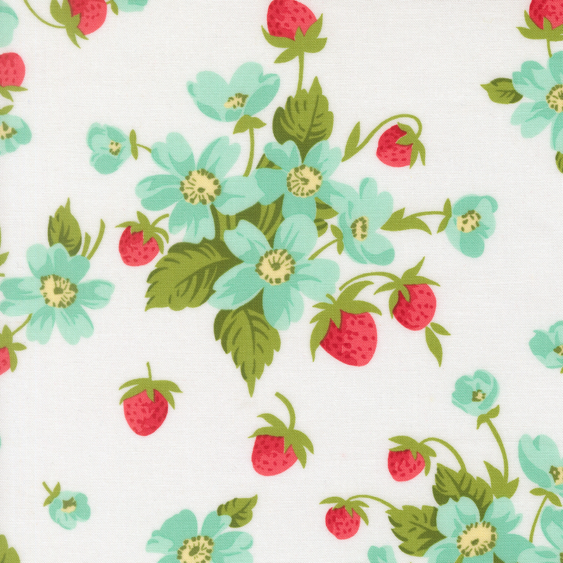 A white fabric with bunches of strawberry plants with blue flowers. 