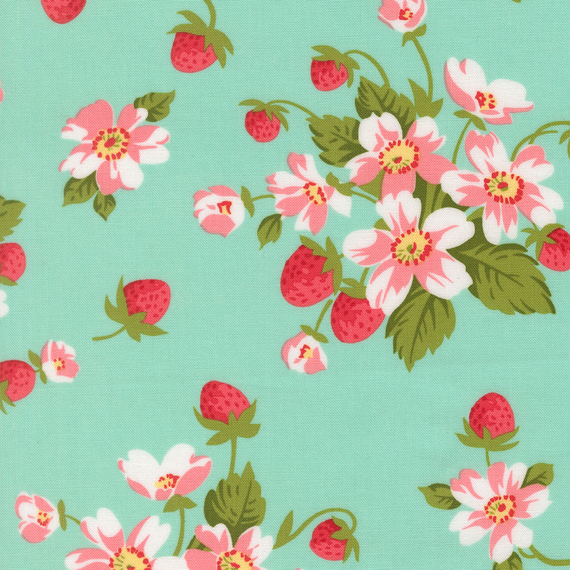 A aqua fabric with bunches of strawberry plants with pink flowers. 