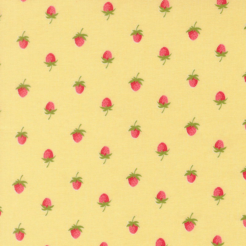 A butter yellow fabric with a half drop pattern of red strawberries. 