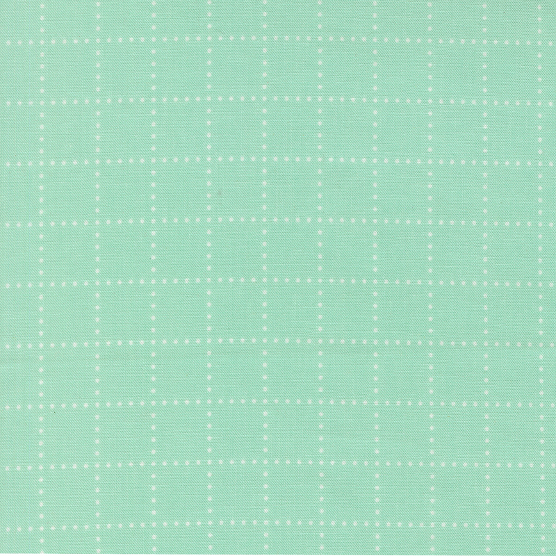 A aqua fabric with white dots forming a grid. 